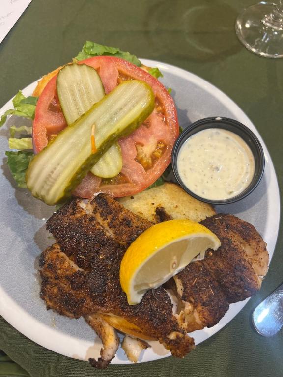 Blackened Grouper sandwich on a white plate