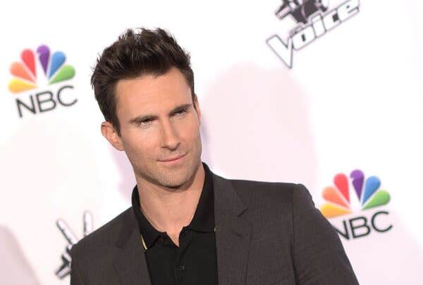 Adam Levine wearing a black dress shirt with gray coat during the NBC's "The Voice" Season 7 Red Carpet Event