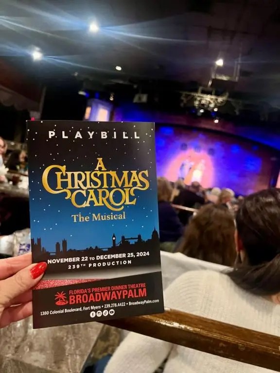 A Christmas Carol opens in Fort Myers and this is the playbill with a stage in the background. Things to do Thanksgiving weekend in SWFL